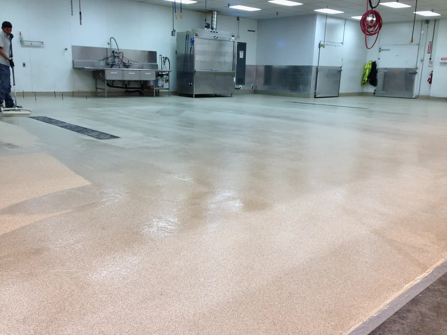 The finished cementitious urethane floor running back to the ovens and sinks at Costco Abbotsford