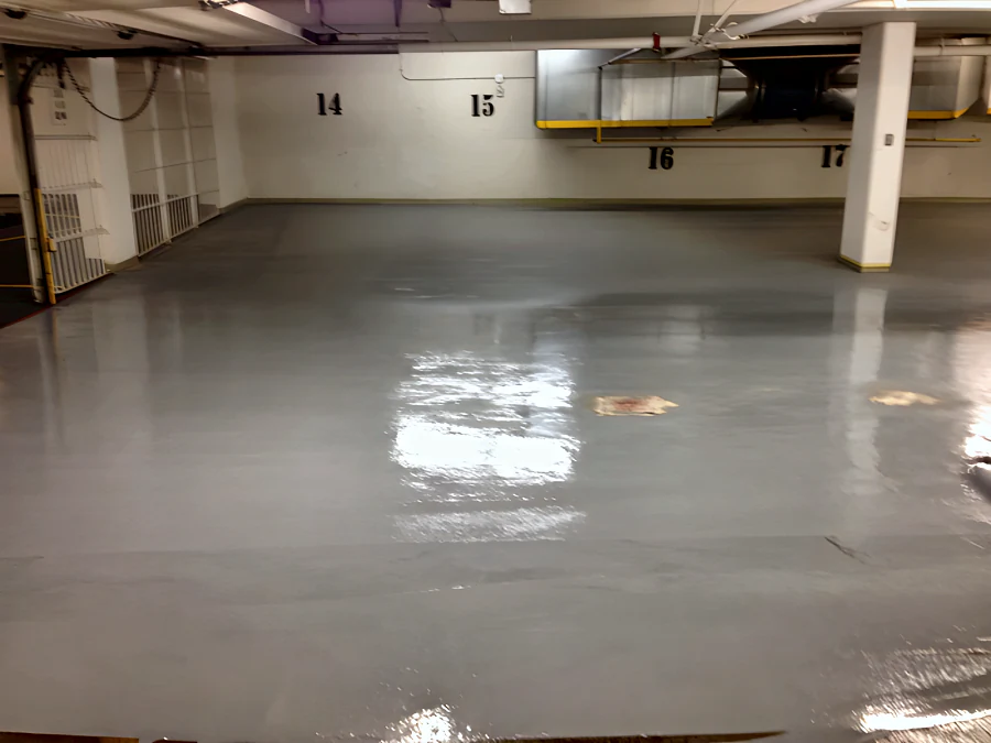 Fresh grey coat, still wet, across the stalls of the Hampton Inn & Suites parkade in Downtown Vancouver