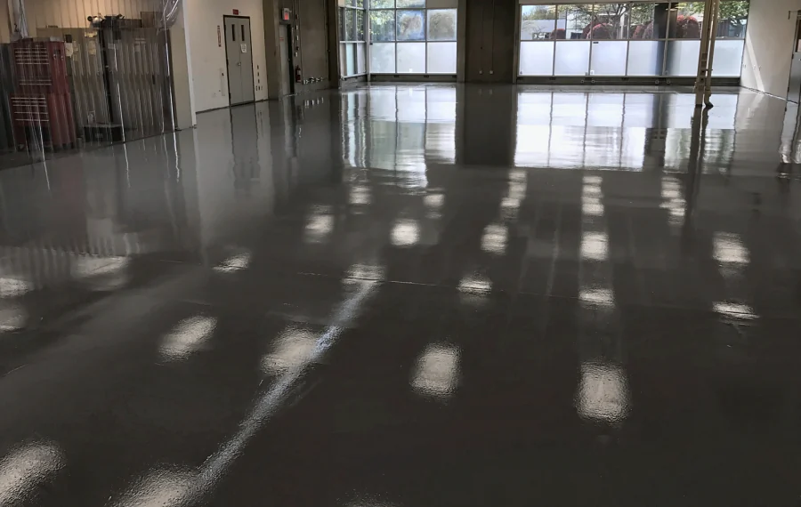 The finished high-gloss grey ESD floor coating of a Kodak-owned printing company in Richmond, running to the windows at the far end