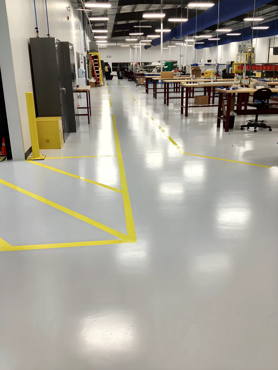 Workshop floor with yellow bay line marking at MTU Canada
