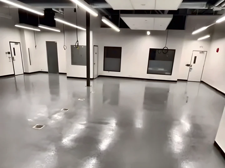 Glossy grey ResinTech TUE floor across the Lush manufacturing floor, handed back