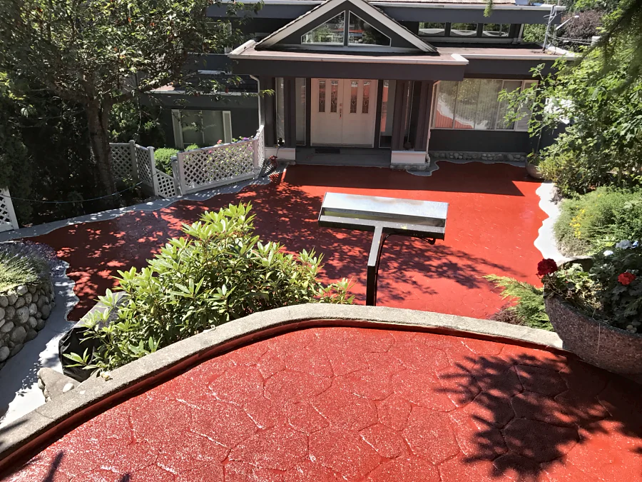 The entry court of a North Vancouver home coated in red ResinTech CRU up to the front door
