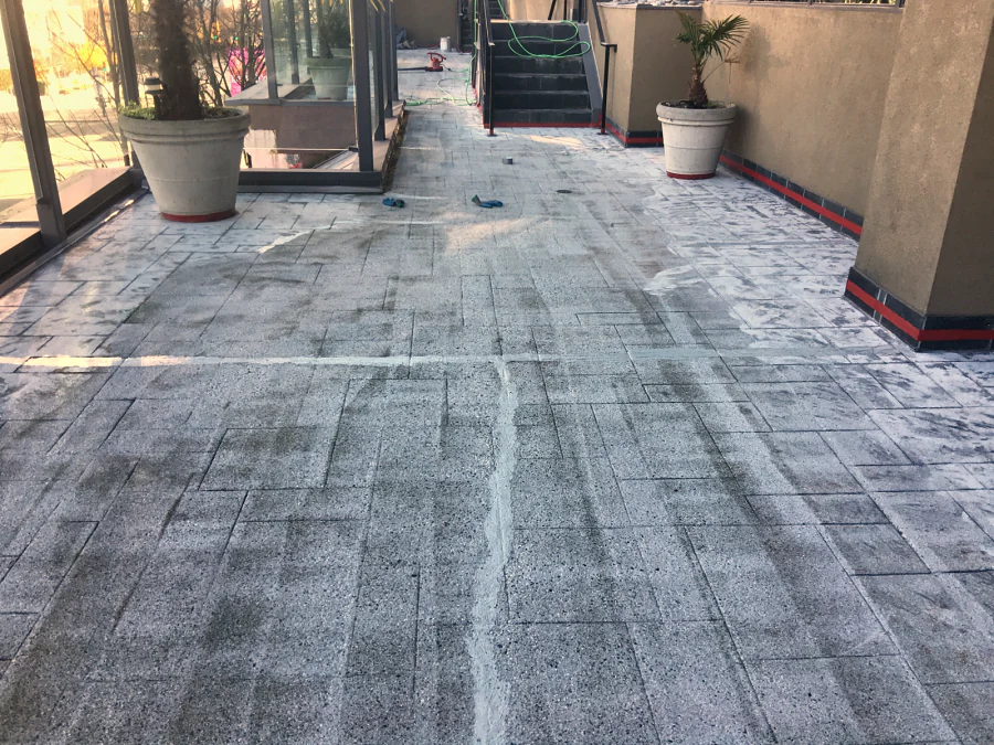 The Moxies patio deck at the Sandman Hotel West Georgia cleaned, with its cracks and joints filled before the traffic coating