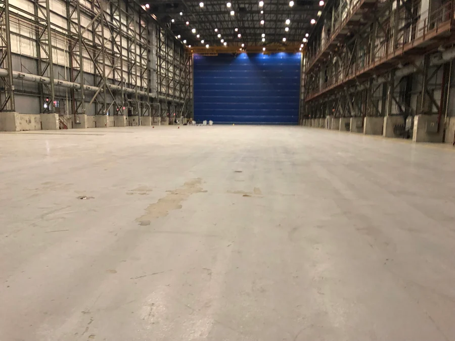 The bare concrete slab of the hall before coating, 60,000 square feet, from the same spot, Seaspan, North Vancouver, 2018