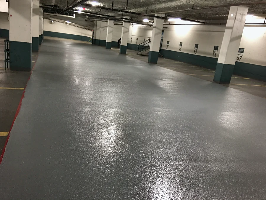 The recoated drive aisle in its grey textured top coat, between the stalls, 2016