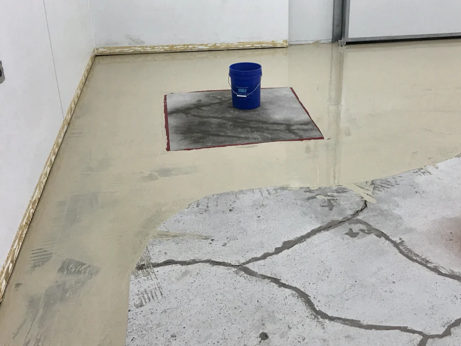 ResinTech TUE going down over the prepared, crack-filled slab of a walk-in cooler