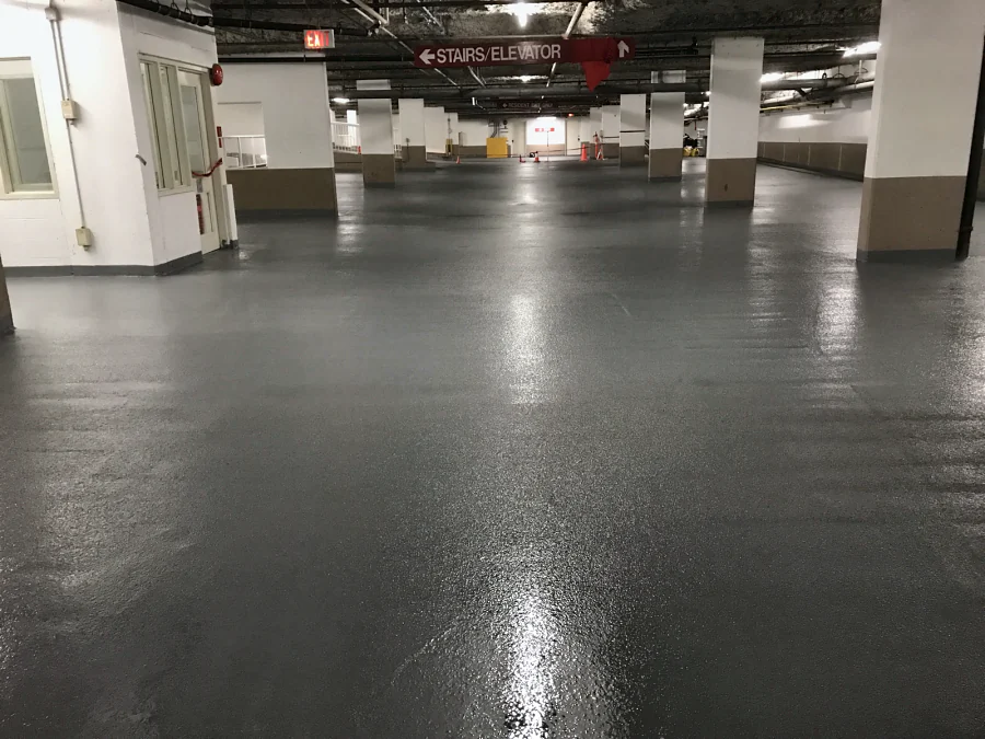 The finished parking level in its new grey coat, towards the stairs and elevator